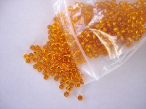 Debbie Abrahams Silver Lined Orange Beads Size 8/0